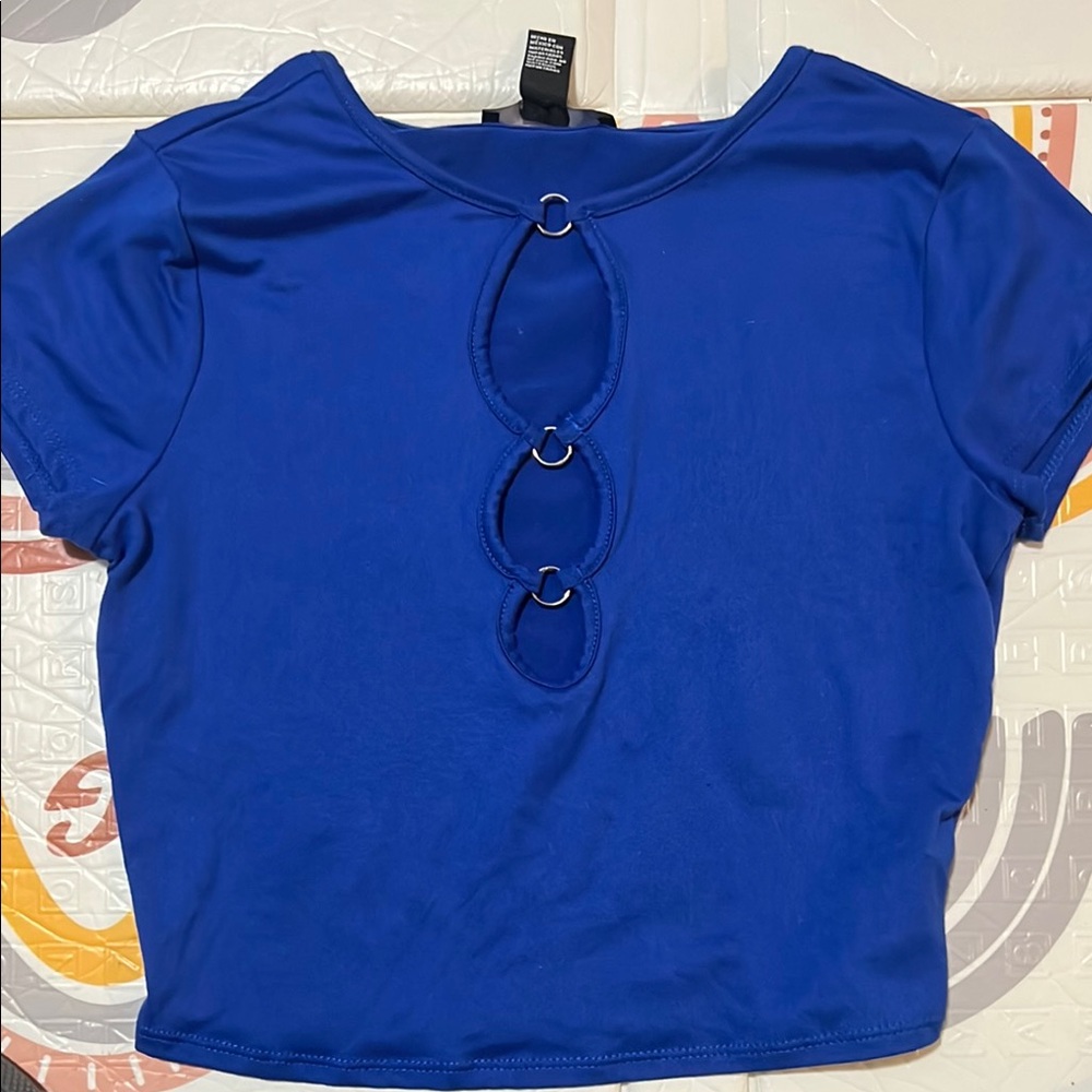 Vibrant blue short sleeve blouse with cut out details